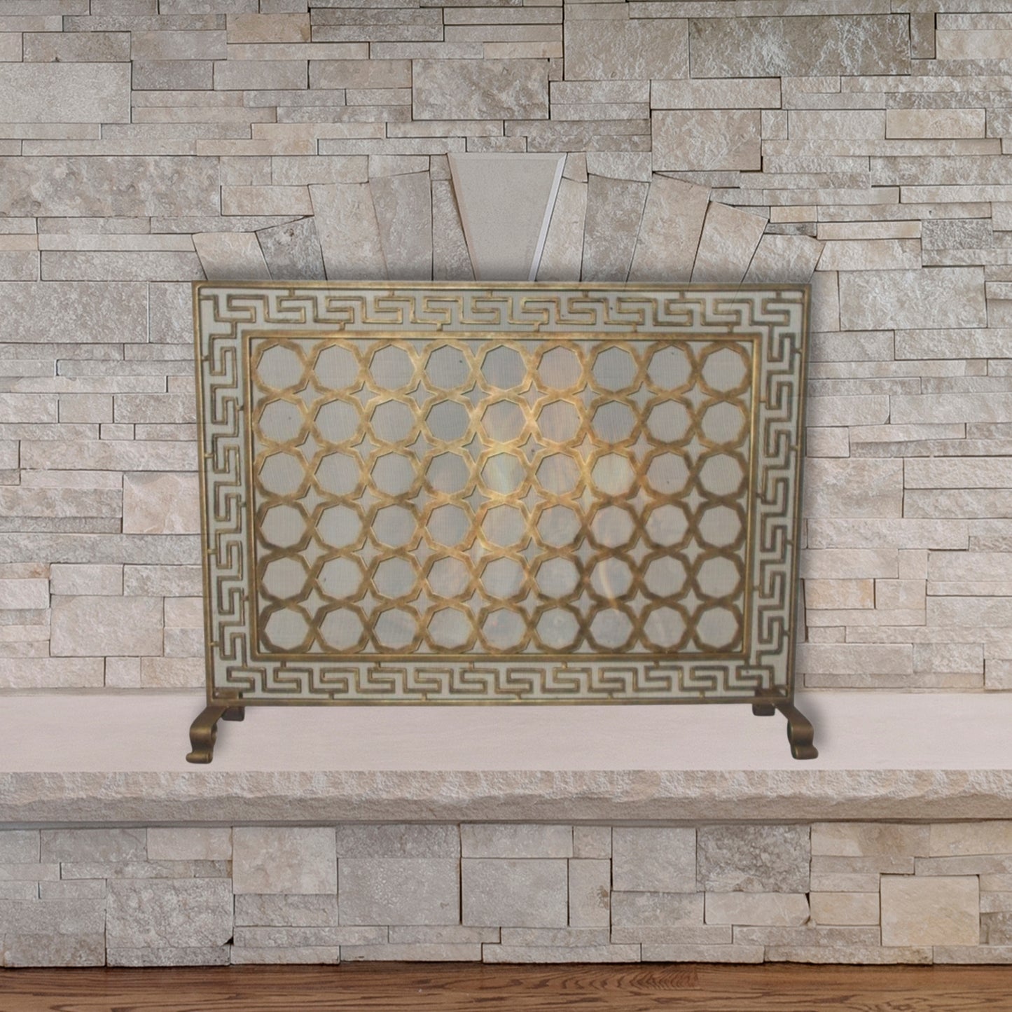 Greek Key Designer Fireplace Screen in a Light Burnished Gold Finish - Single Panel Screen in front of stone fireplace | InsideOutCatalog.com