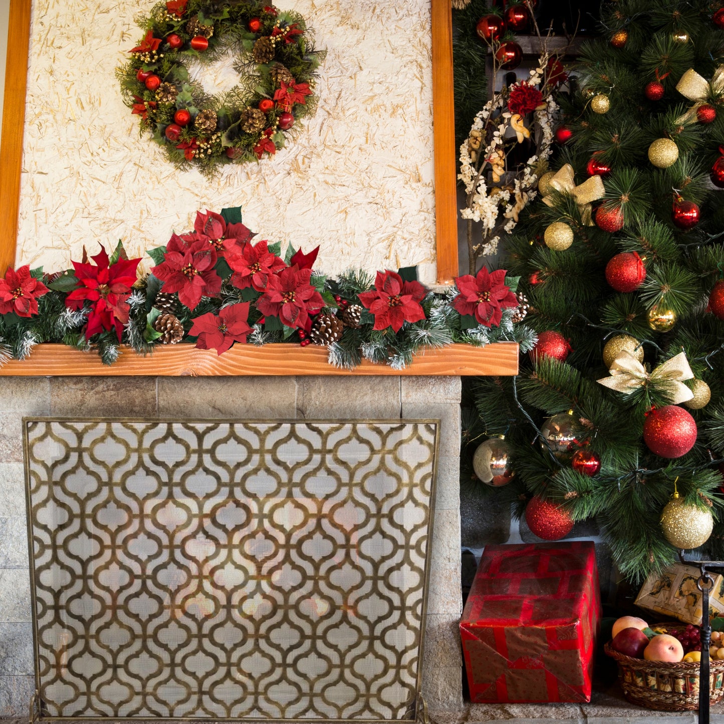 Large Iron Fire Screen with Quadrille Design - Light Burnished Gold Single Panel Fireplace Screen in front of fireplace next to Christmas decorations and tree | InsideOutCatalog.com