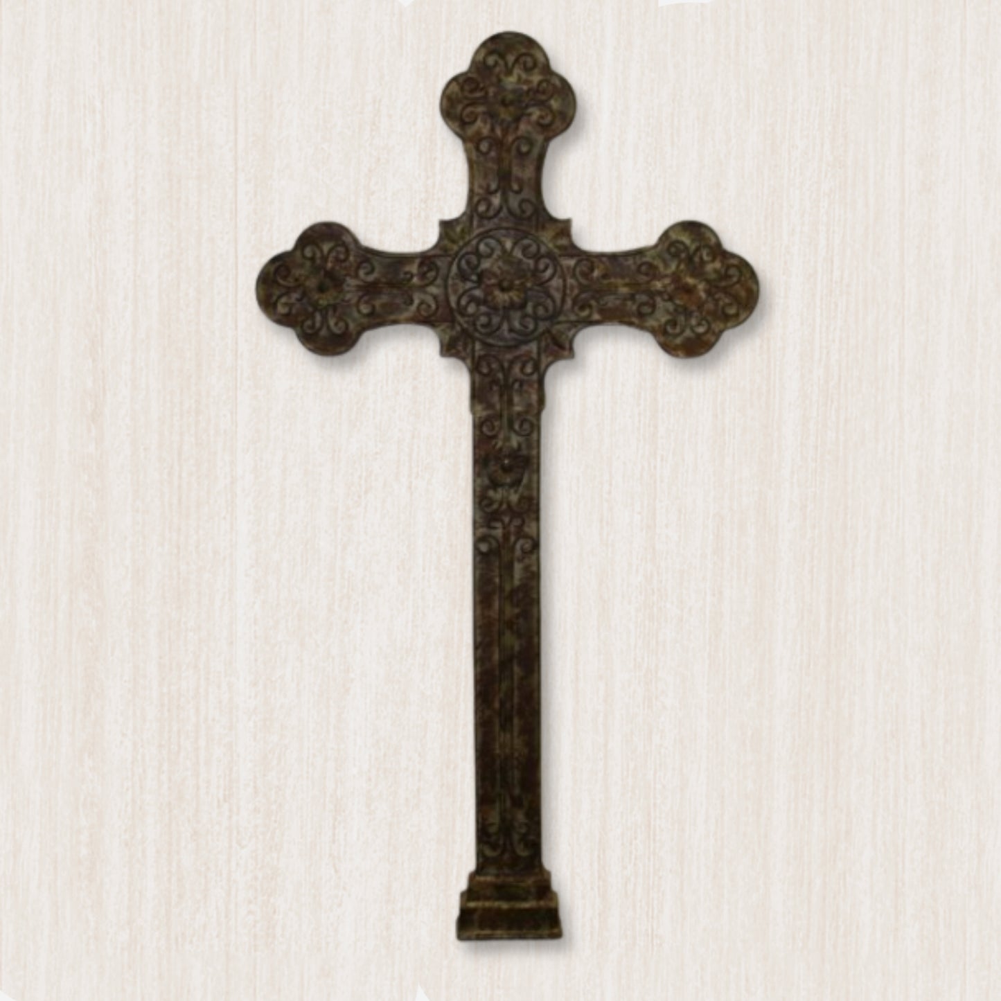A large wall-mounted iron cross with intricate designs, finished in brown taupe, displayed against a textured background | INSIDE OUT - InsideOutCatalog.com