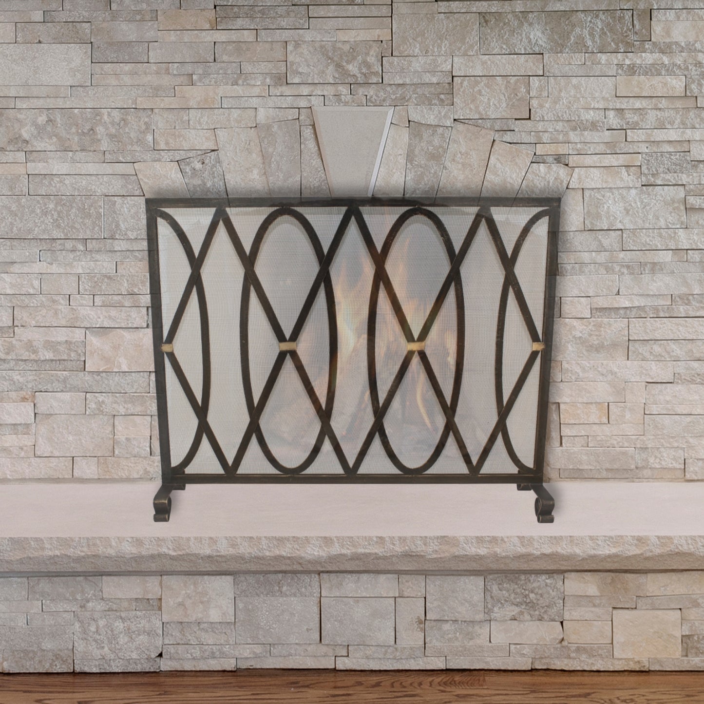 Oval and Diamond Design Single Panel Iron Fire Screen with Mesh - Burnished Gold Iron Screen in front of stone fireplace | InsideOutCatalog.com