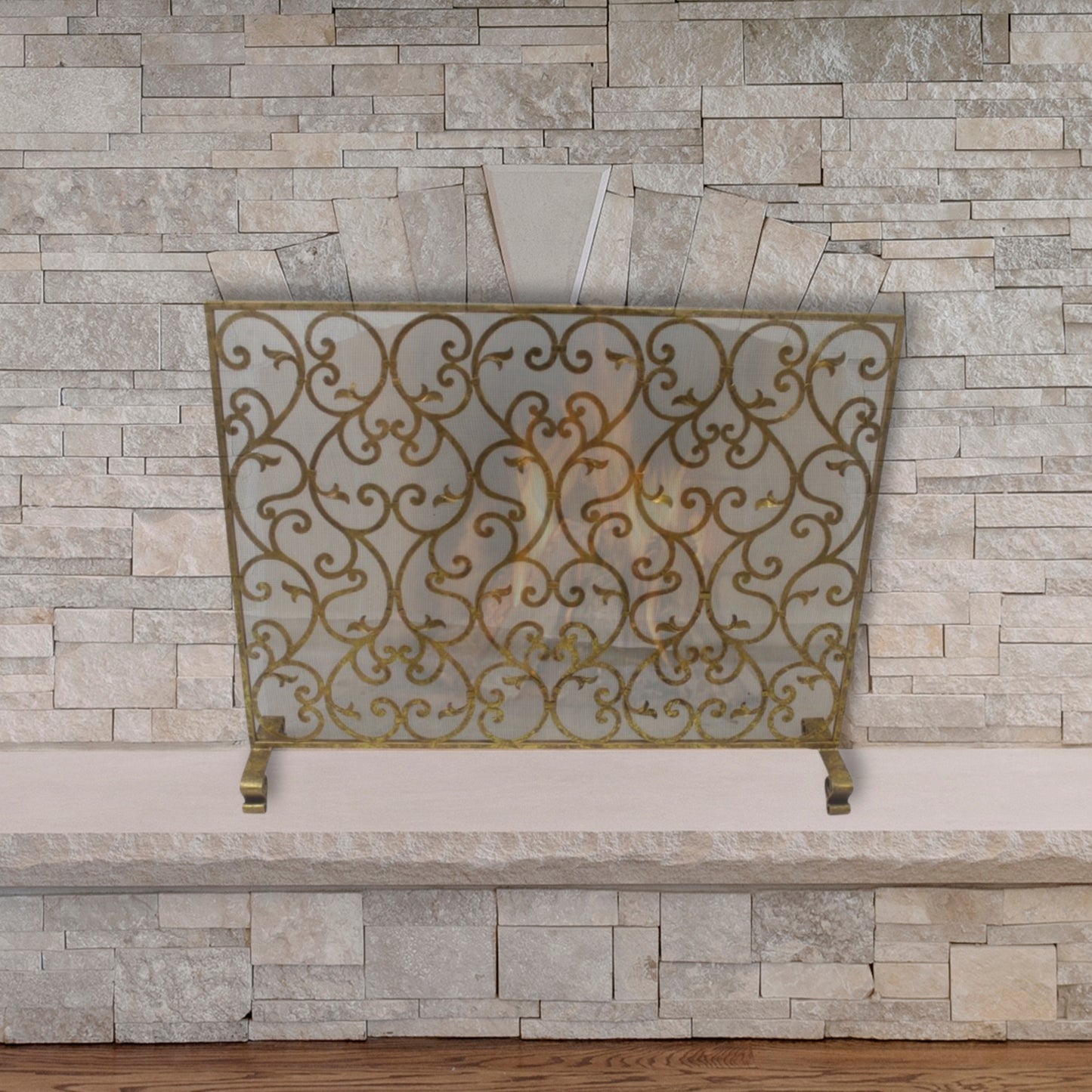 Scroll and Leaf Design Single Panel Fireplace Screen in Italian Gold Finish against stone fireplace | InsideOutCatalog.com