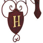 Wrought Iron Hanging Monogram Plaque with Iron Wall Bracket (33"H) | Estate Quality Home Decor | Personalized Wall Decor | Shown with the Monogram "H" | Iron finished in a rustic brown gold stain with Italian gold 5" monogram (close up of monogram letter) | INSIDE OUT | InsideOutCatalog.com