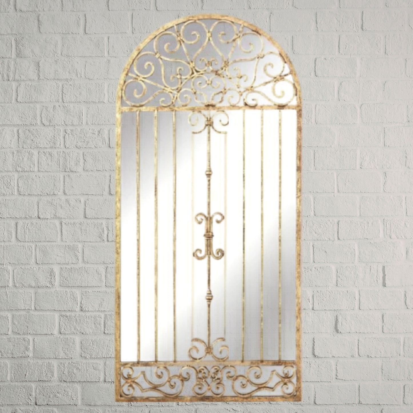 Antique Gold European Inspired Arched Garden Gate Mirror on white brick wall | INSIDE OUT | InsideOutCatalog.com
