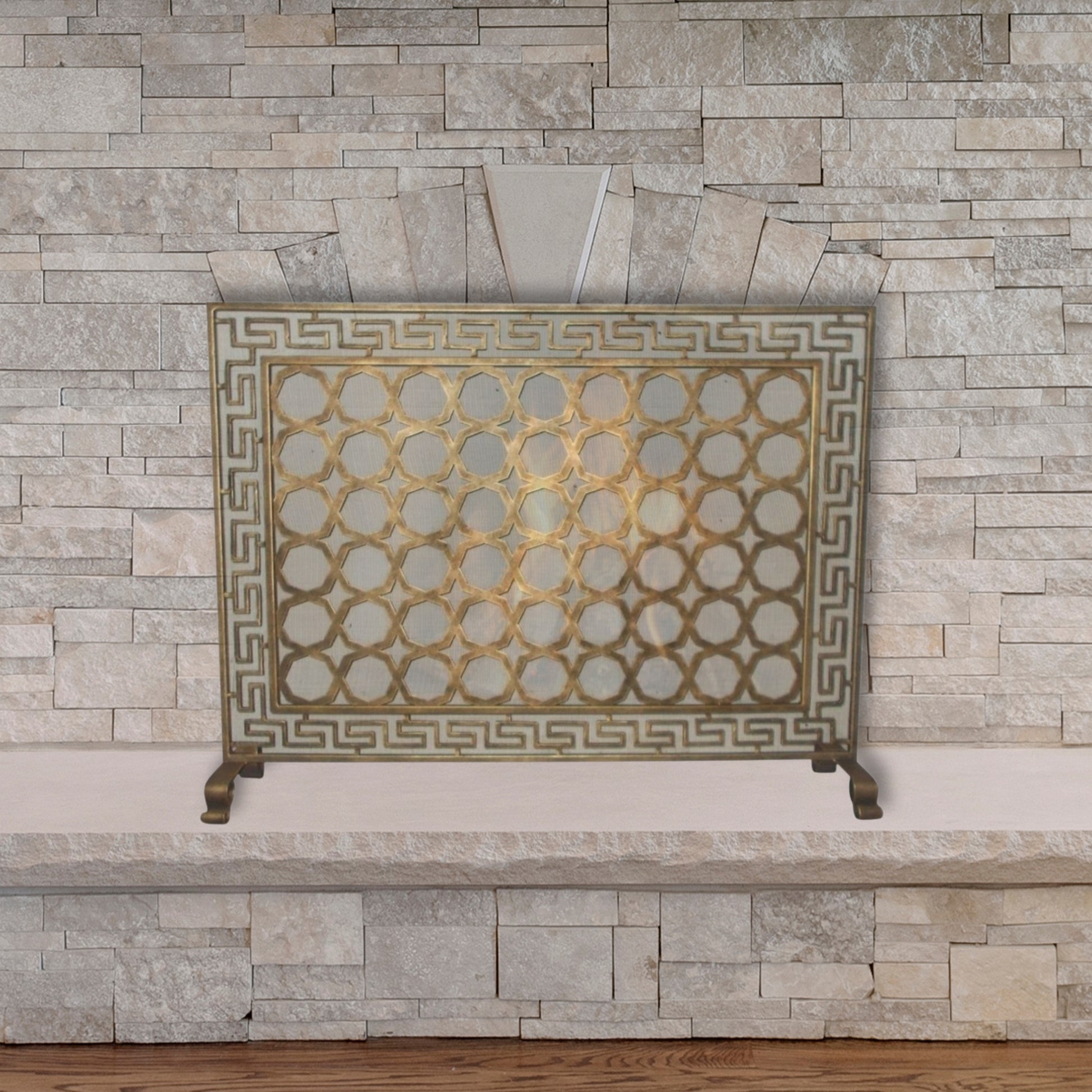 Greek Key Designer Fireplace Screen in a Light Burnished Gold Finish - Single Panel Screen in front of stone fireplace | InsideOutCatalog.com