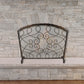 Iron Loop Design Fireplace Screen with Arched Top - Single Panel Fire Screen in front of stone fireplace | InsideOutCatalog.com