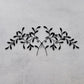 Olive Leaf Iron Wall Grille - Black Metal Wall Decor on textured grey wall | INSIDE OUT | InsideOutCatalog.com