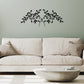 Olive Leaf Iron Wall Grille - Black Metal Wall Decor | Beige sofa with decorative wall art of black leaves on a light sage wall  | INSIDE OUT - InsideOutCatalog.com