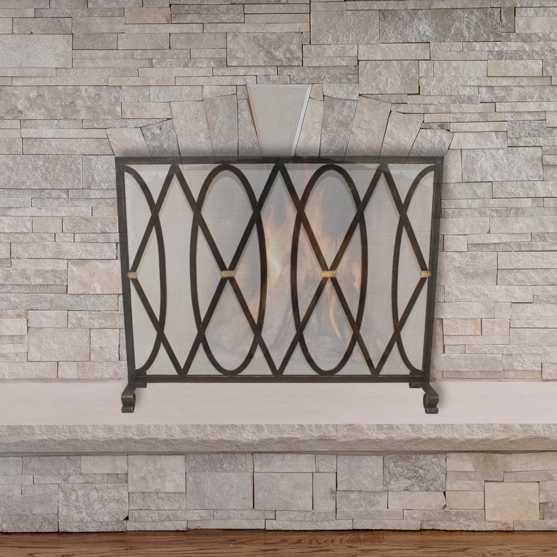 Oval and Diamond Design Single Panel Iron Fire Screen with Mesh - Burnished Gold Iron Screen in front of stone fireplace | InsideOutCatalog.com