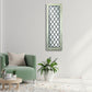 Wood Frame Rectangular Mirror with Metal Diamond Accents | Living room with a green armchair, coffee table, and decorative mirror on the wall | INSIDE OUT - InsideOutCatalog.com