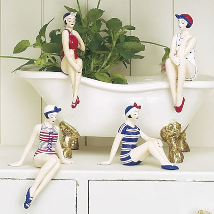 Red, White, and Blue Vintage Americana Bathing Beauty Mini Figurine Collection - Set of Four shown displayed in a bathroom | INSIDE OUT | InsideOutCatalog.com