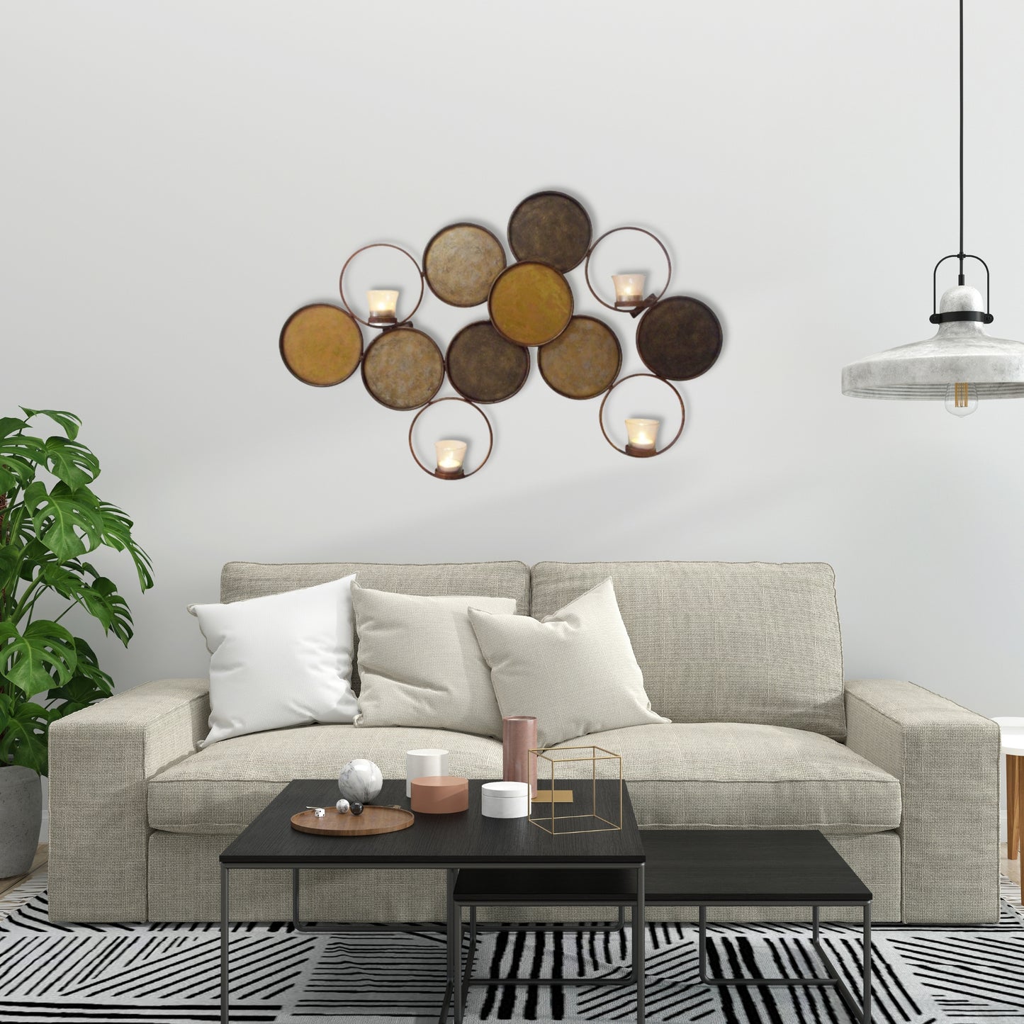 Gold Circle Wall Decor - Four Votive Candle Holder Wall Accent (31"W) shown as living room wall decor over a comfy sofa | InsideOutCatalog.com