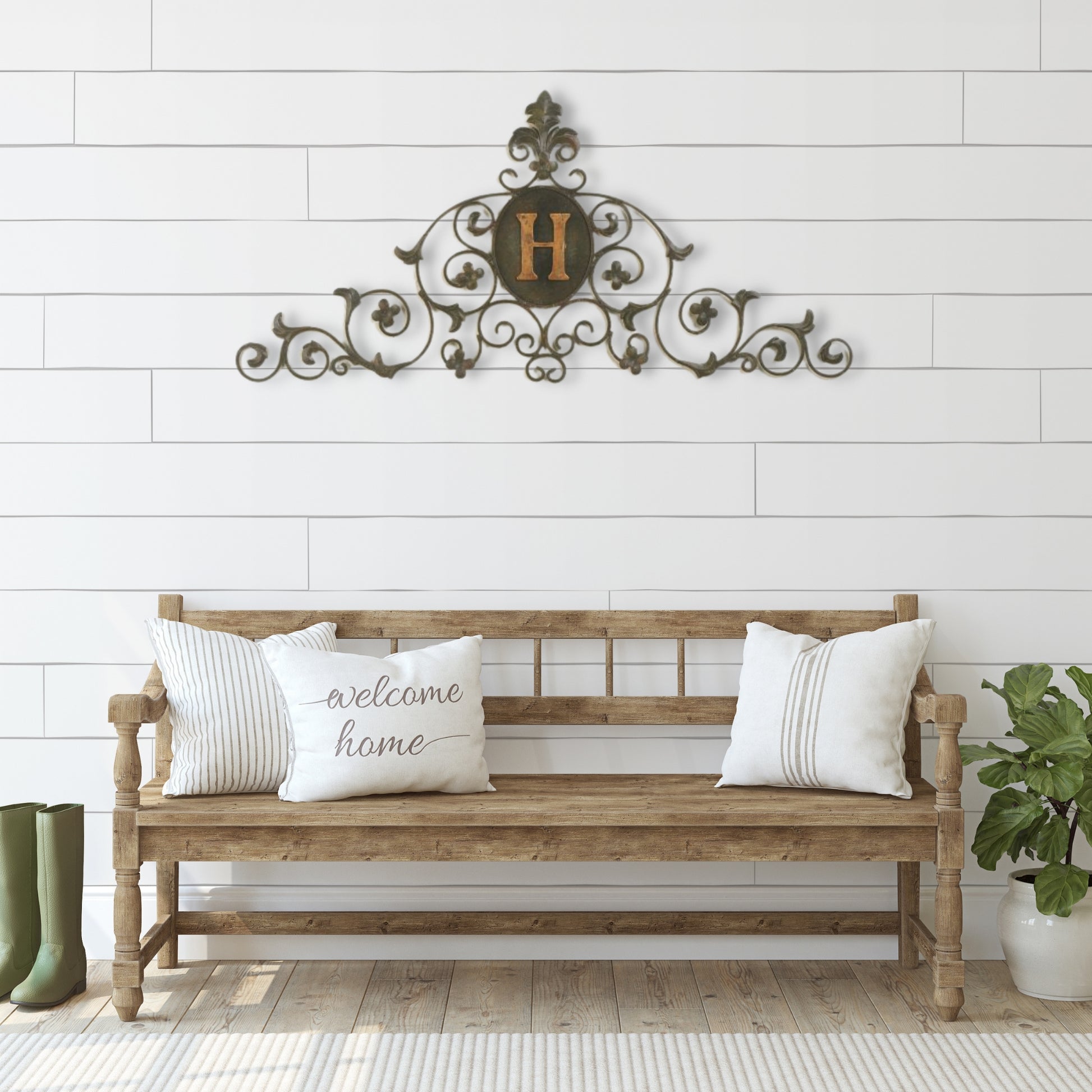 Leaf and Fleur de Lis Iron Monogrammed Wall Grille - Monogram Wall Decor | Estate Quality Home Decor | Personalized Wall Decor | Shown with the Monogram "H" | Iron finished in a faux green brown stain with Italian gold 5" monogram shown over rustic wood bench on front porch | INSIDE OUT | InsideOutCatalog.com