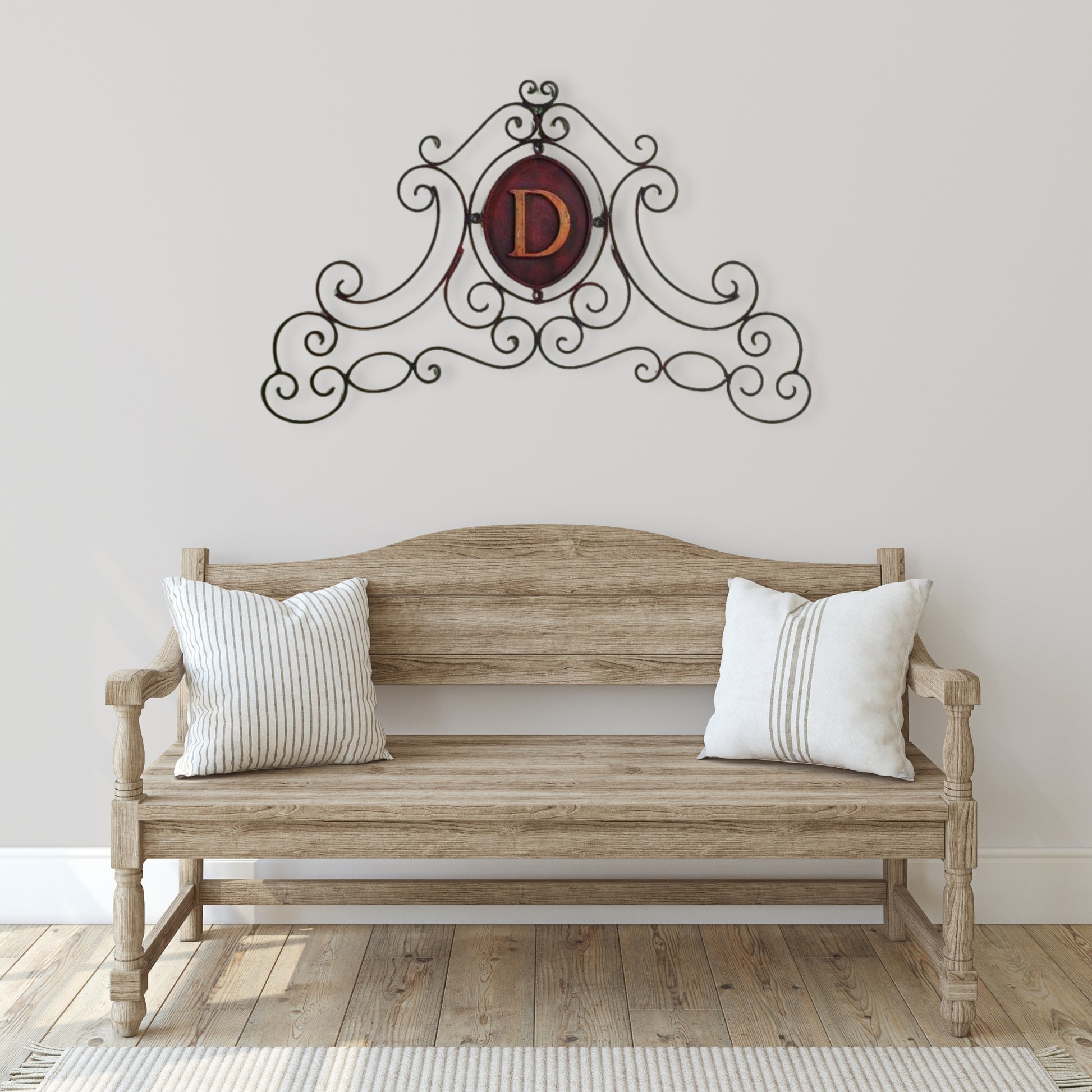 Monogrammed Iron Scroll Wall Grille - Monogram Wall Decor | Estate Quality Home Decor | Personalized Wall Decor | Shown with the Monogram "D" | Iron finished in a antique brown with Italian gold 5" monogram shown over large wood bench | INSIDE OUT | InsideOutCatalog.com